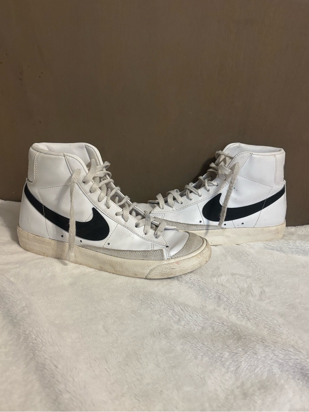 Nike White High-Top Sneakers with Black Swoosh
